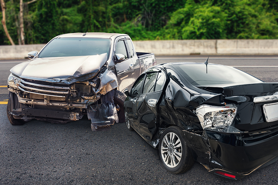 Car crash claim, road traffic accident claim. Car crash accident damage on the road.