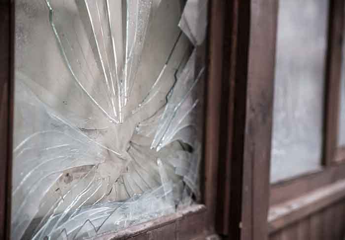 broken windows disrepair, cracked window in window frame outside